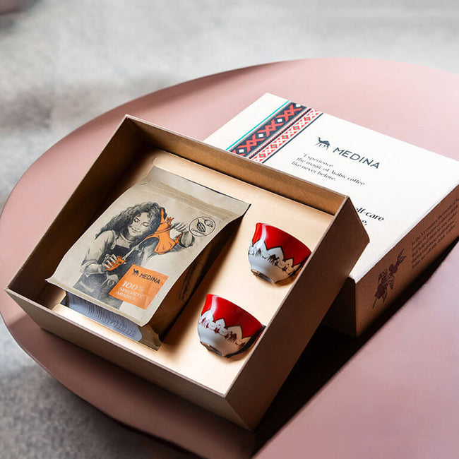 arabic coffee gift set box opened with one coffee bag and two coffee cups inside