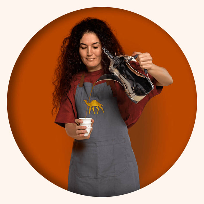 Medina Pouring Coffee with Background